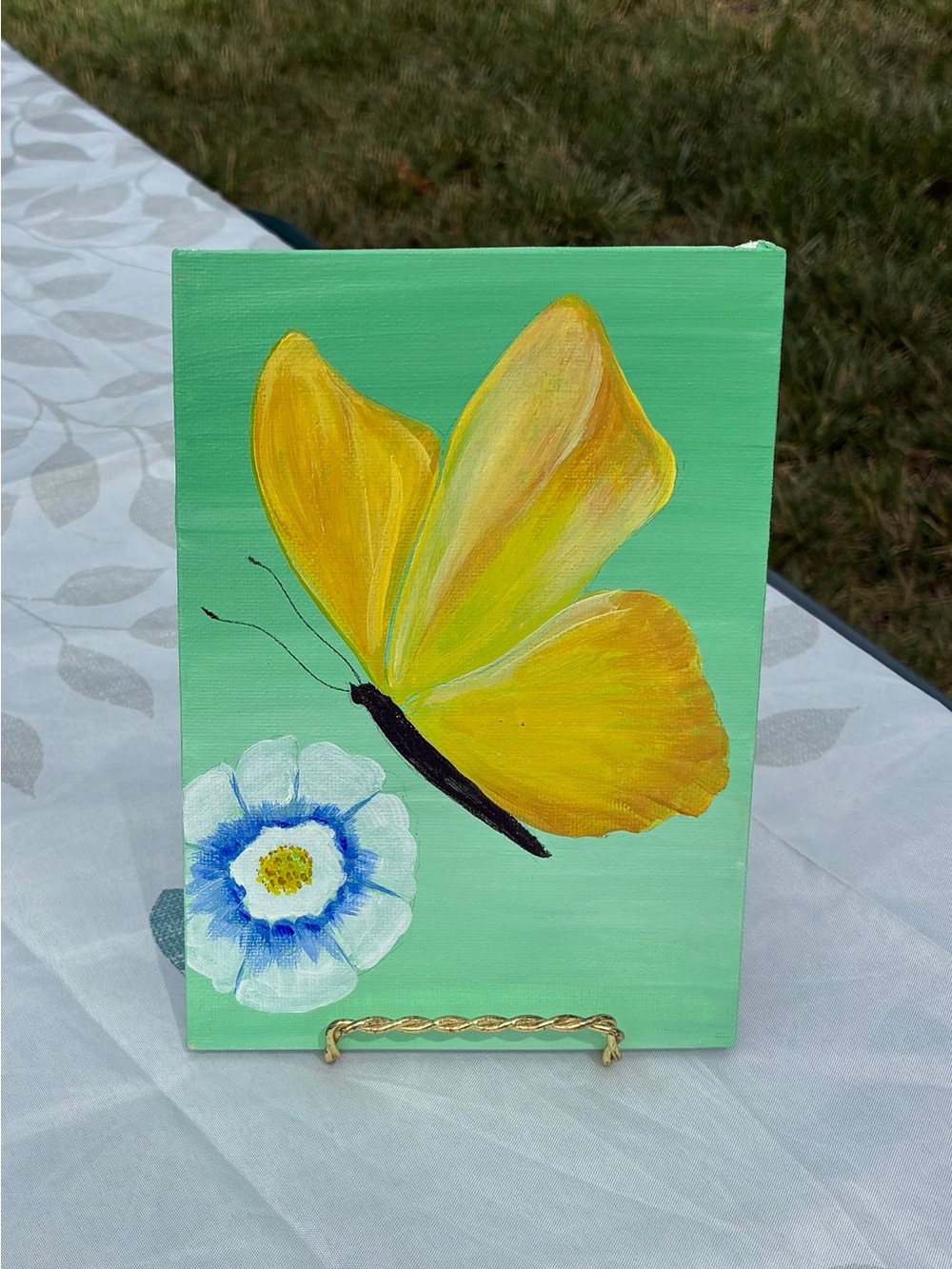 Vibrant Yellow Butterfly Canvas Art on Green